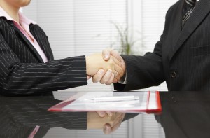 Lawyer and client are handshaking after successful meeting