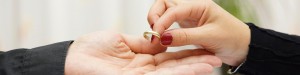 Woman giving man back gold wedding band